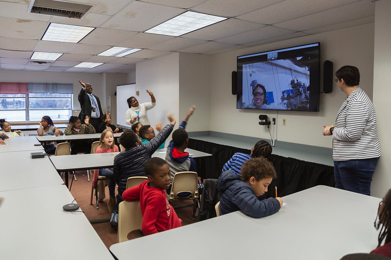 Distance Learning Lab at John B. Cary Elementary School in Richmond, Virginia. Seen on the large screen: Kiara Corbin, a junior majoring in mechanical engineering who works in the Maker Garage at VCU Engineering.